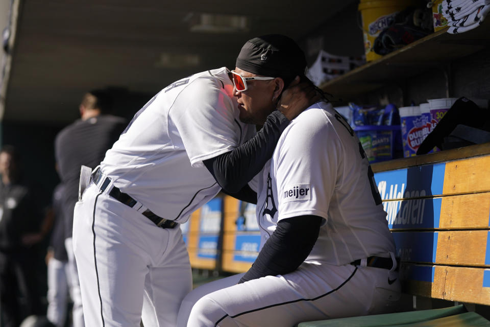 Detroit Tigers' Miguel Cabrera, right, is hugged by first base coach Alfredo Amezaga, left, before the first inning of a baseball game against the Cleveland Guardians, Sunday, Oct. 1, 2023, in Detroit. Cabrera is playing his last game before retirement. (AP Photo/Paul Sancya)