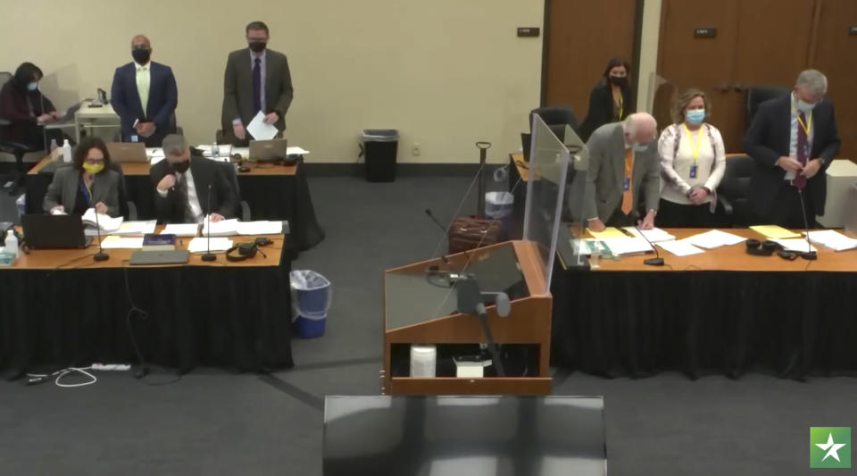 In this screen grab from video, the prosecution, left, and the defense, right, are seen in court as Hennepin County Judge Regina Chu presides over jury selection Wednesday, Dec. 1, 2021, in the trial of former Brooklyn Center police Officer Kim Potter in the April 11, 2021, death of Daunte Wright, at the Hennepin County Courthouse in Minneapolis, Minn. (Court TV via AP, Pool)