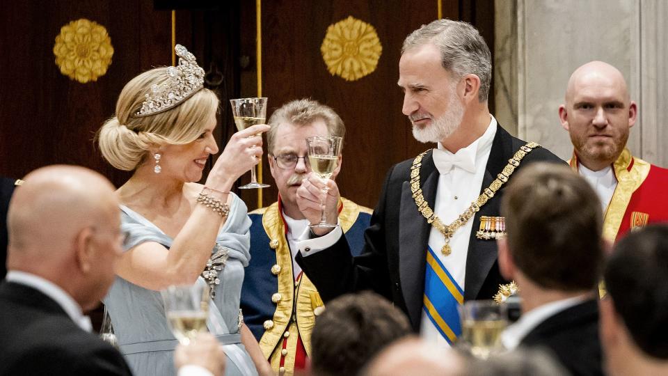 Queen Maxima raising toast to king felipe