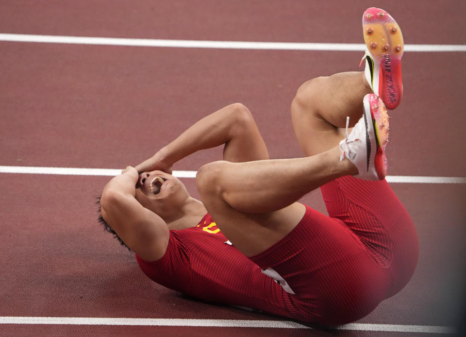 Bingtian Su, of China, reacts after winning a semifinal of the men's 100-meters at the 2020 Summer Olympics, Sunday, Aug. 1, 2021, in Tokyo, Japan. (AP Photo/Charlie Riedel)