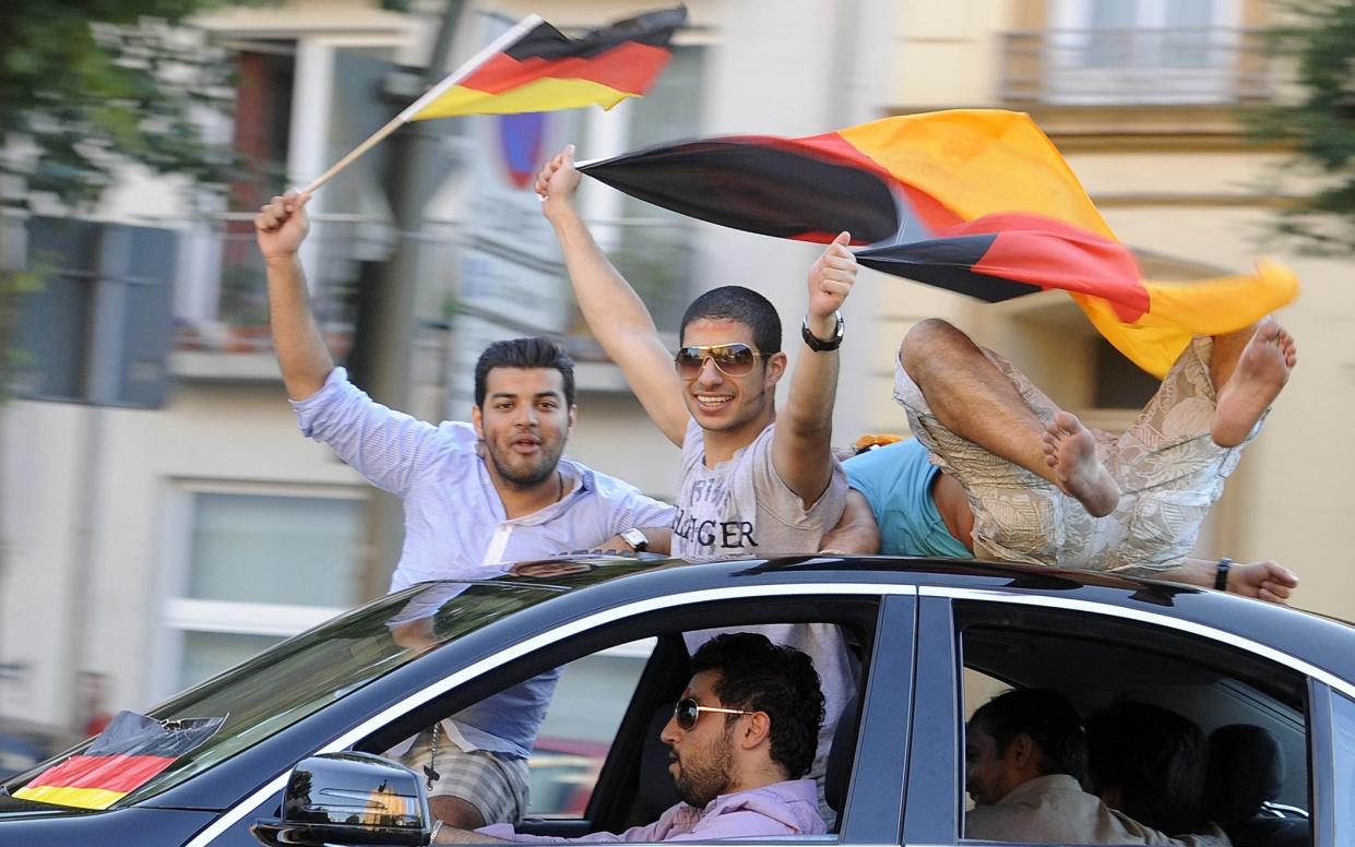 German football fans in Hamburg celebrate victory over England in the 2010 World Cup  - Fabian Bimmer