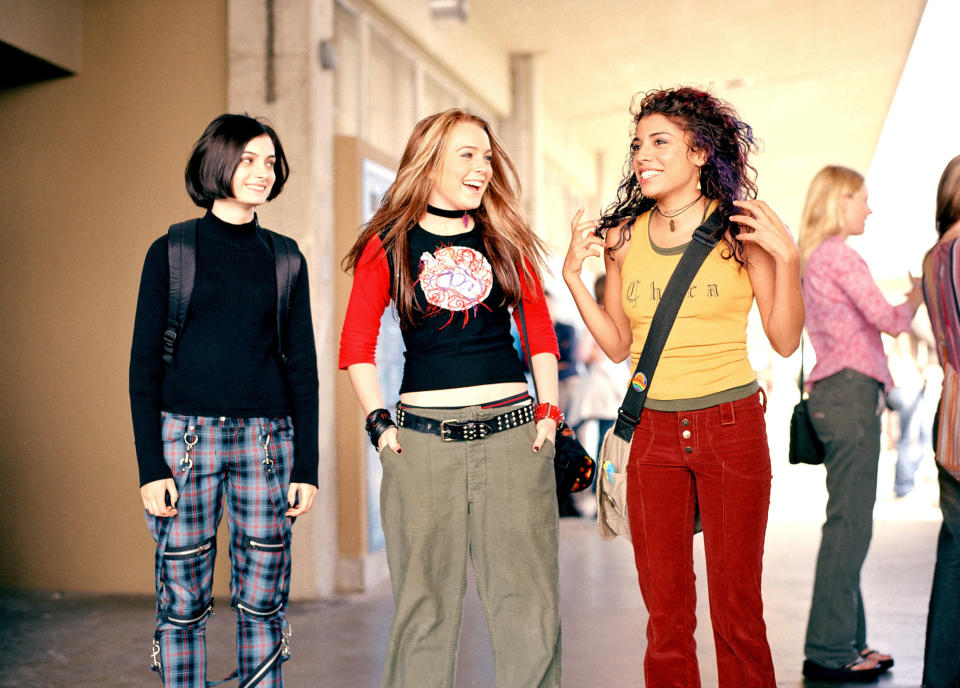 the three teens in a school hallway