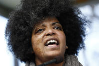 Ash-Lee Henderson, co-executive director at the Highlander Education and Research Center in Tennessee, leads rally participants in a song at a mass gathering at the state Capitol in Jackson, Miss., Friday, Jan. 23, 2020, protesting conditions in prisons where inmates have been killed in violent clashes in recent weeks. (AP Photo/Rogelio V. Solis)