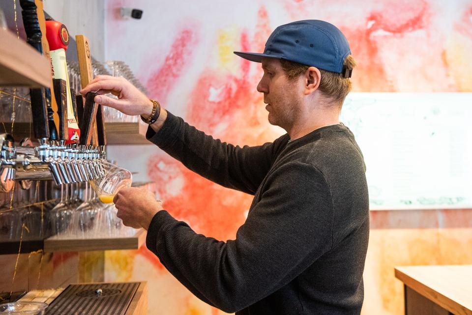 Sean Bowman, owner of Foreign Objects Brewery pours a glass of beer at Foreign Objects Brewery in Monroe, NY on Thursday, January 13, 2022.