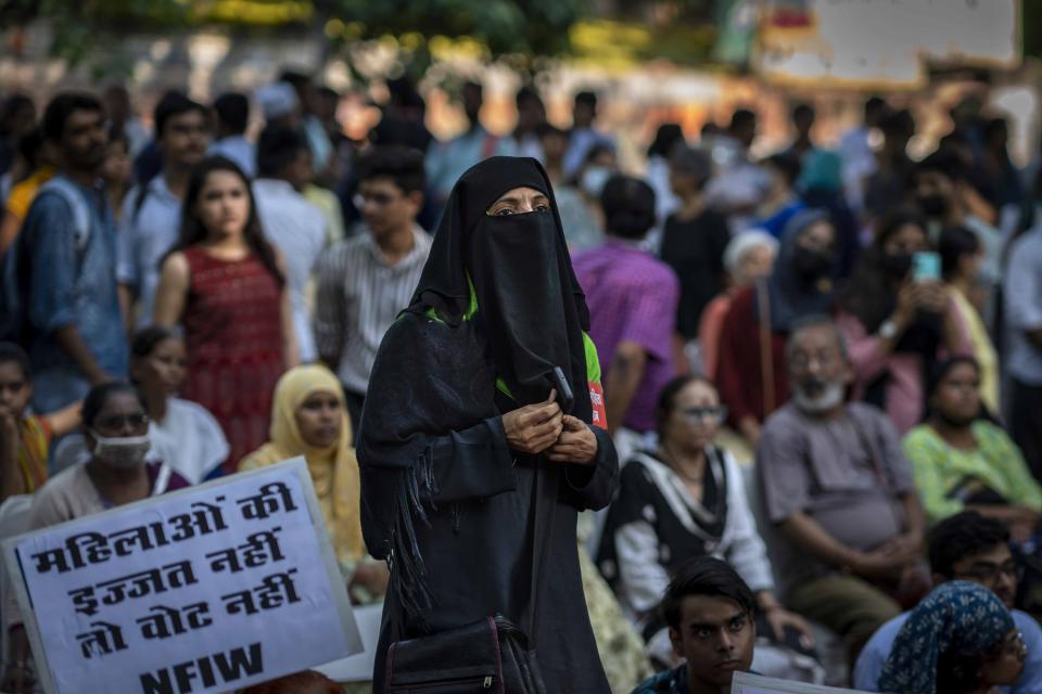 A Muslim woman participates in a protest demonstration against remission of sentence by the government to convicts of a gang rape of a Muslim woman, in New Delhi, India, Saturday, Aug. 27, 2022. Hundreds of people on Saturday held demonstrations in several parts of India to protest a recent government decision to free 11 men who had been jailed for life for gang raping a Muslim woman during India’s devastating 2002 religious riots. (AP Photo/Altaf Qadri)