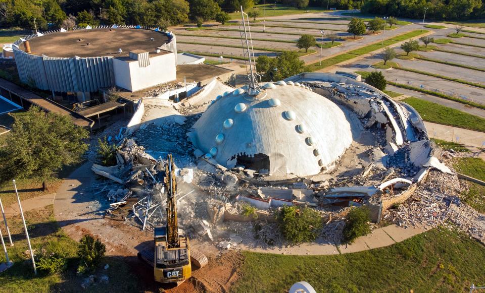 Crews work Monday to demolish First Christian Church in Oklahoma City. The church's dome that was for decades a landmark in the city skyline is shown shortly after it collapsed during demolition.