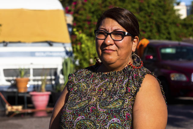 Mobile home resident Alondra Ruiz Vazquez on Tuesday, April 11, 2023, in Phoenix, Ariz. Dozens of families face eviction from there mobile homes to make room for student housing. (AP Photo/Ty O'Neil)