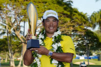 Hideki Matsuyama, of Japan, holds the champions trophy after the final round of the Sony Open golf tournament, Sunday, Jan. 16, 2022, at Waialae Country Club in Honolulu. (AP Photo/Matt York)