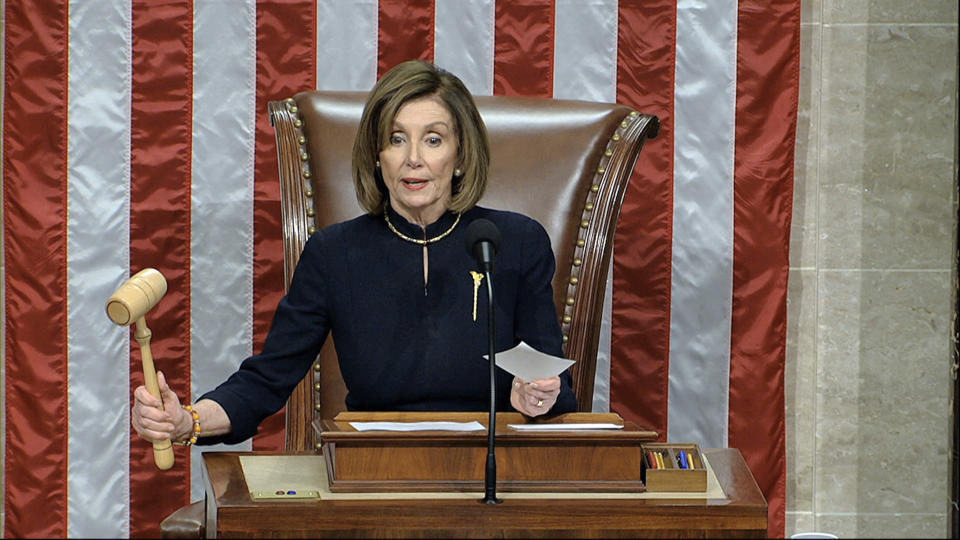 House Speaker Nancy Pelosi of Calif., announces the passage of the first article of impeachment, abuse of power, against President Donald Trump by the House of Representatives at the Capitol in Washington, Wednesday, Dec. 18, 2019. (House Television via AP)