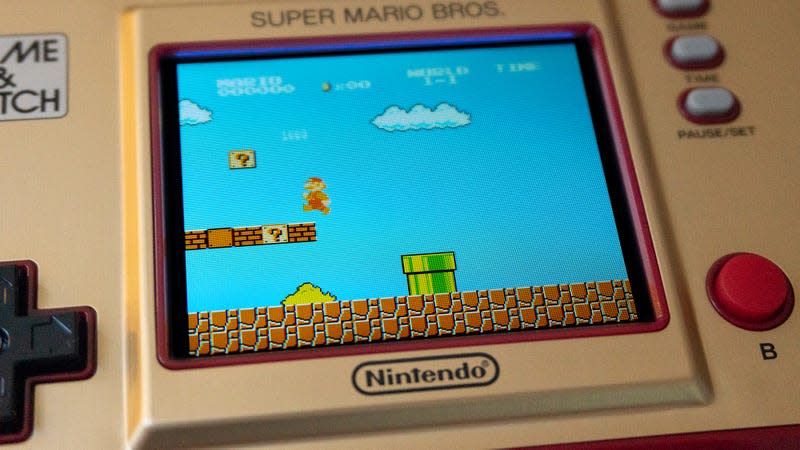 A close-up of Super Mario Bros. being played on the Nintendo Game & Watch: Super Mario Bros. handheld.