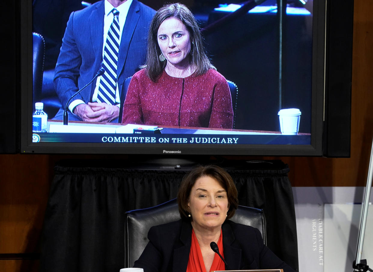 Amy Klobuchar, bottom, and Amy Coney Barrett