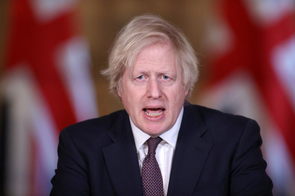 Britain's Prime Minister Boris Johnson attends a virtual press conference inside 10 Downing Street in central London on March 8, 2021, to give an update on the coronavirus covid-19 pandemic. - Millions of children returned to school in England on Monday for the first time in two months, with the government beginning to ease coronavirus restrictions as a mass vaccination drive ramps up. The resumption of classroom teaching was the first step on a path which the government hopes will see life return to normal by late June. (Photo by HANNAH MCKAY / POOL / AFP) (Photo by HANNAH MCKAY/POOL/AFP via Getty Images)