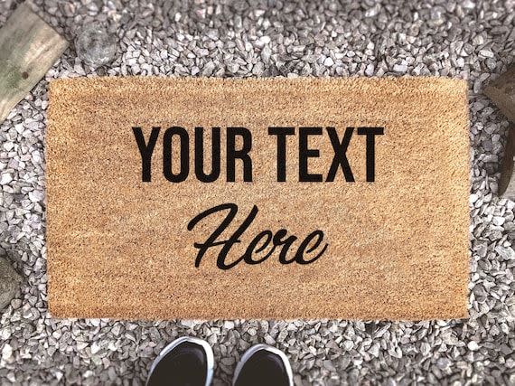 <p><strong>Customat</strong></p><p>etsy.com</p><p><strong>$14.50</strong></p><p>Another great couple gift in the realm of personalization: a doormat. Just a little something to show you care. </p>