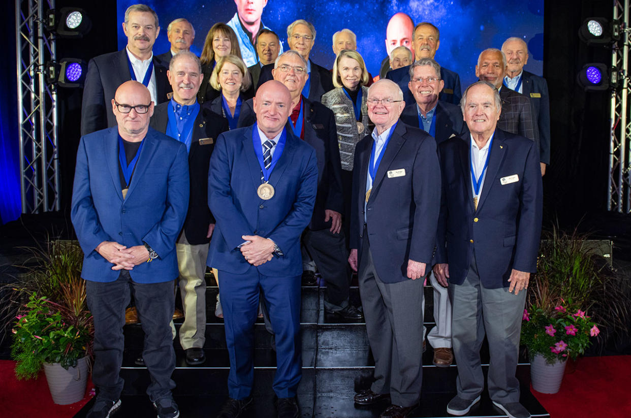  2023 U.S. Astronaut Hall of Fame inductees Roy Bridges (at center right) and Senator Mark Kelly (center left) pose with prior inductees during their ceremony at Kennedy Space Center Visitor Complex in Florida on Saturday May 6, 2023. The other astronauts pictured include (from left to right): Scott Kelly, Scott Altman, Curt Brown, John Grunsfeld, Janet Kavandi, Pam Melroy, Michael Lopez-Alegria, Daniel Brandenstein, John Blaha, Rhea Seddon, Rusty Schweickart, Joe Kerwin, Hoot Gibson, David Leestma, Bob Crippen, Charlie Bolden and Loren Shriver. 