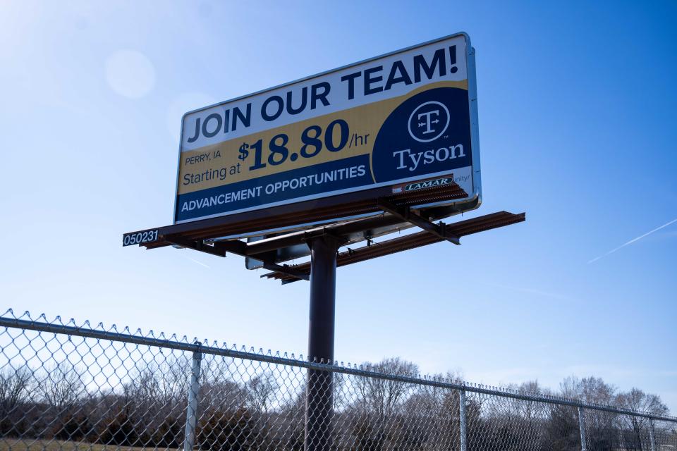 A billboard for Tyson Foods sits outside the Perry pork packaging plant Monday March 11, 2024, along Westbound 141 in Perry, IA.