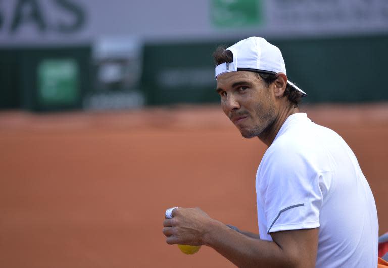 Spanish tennis player Rafael Nadal takes a break during a training session prior the 2015 French Open Tennis championships at the Roland Garros stadium in Paris on May 20, 2015