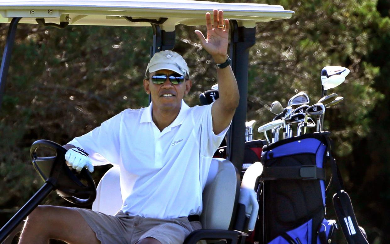 Barack Obama between rounds of golf in Martha's Vineyard, 2013 - AP Photo/Steven Senne