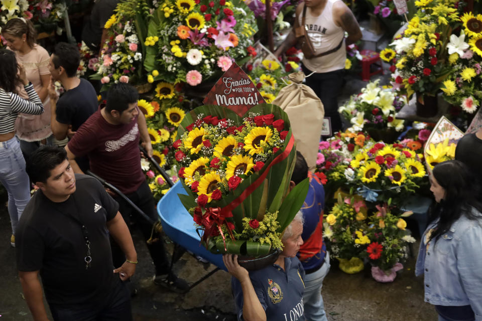 People go to buy flowers prior to the Mother's Day celebration at a market in Mexico City.  / Credit: Luis Barron / Eyepix Group/Future Publishing via Getty Images