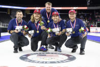 FILE - From left, Team Shuster's John Landsteiner, Matt Hamilton, coach Sean Beighton, Chris Plys and John Shuster pose with their gold medals after winning their match against Team Dropkin during the third night of finals at the U.S. Olympic Curling Team Trials at Baxter Arena in Omaha, Neb., Sunday, Nov. 21, 2021. Team Shuster won the match will represent Team USA at the 2022 Beijing Winter Olympics. (AP Photo/Rebecca S. Gratz, File)