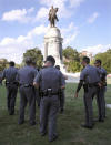 <p>Capitol Police officers are posted around the statue of Confederate Gen. Robert E. Lee Friday, Aug. 18, 2017 in Richmond, Va. Virginia Governor Terry McAuliffe signed an executive order banning any demonstrations at the Lee Monument. (Photo: Bob Brown/Richmond Times-Dispatch via AP) </p>