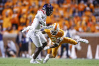 Tennessee defensive back Alontae Taylor (2) tries to tackle Mississippi wide receiver Dontario Drummond during the first half of an NCAA college football game Saturday, Oct. 16, 2021, in Knoxville, Tenn. (AP Photo/Wade Payne)