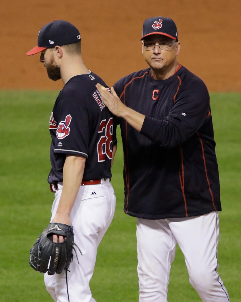 Cleveland manager Terry Francona takes starting pitcher Corey Kluber out of the game during the fifth inning of Game 7 of the World Series against the Chicago Cubs, Wednesday, Nov. 2, 2016, in Cleveland.