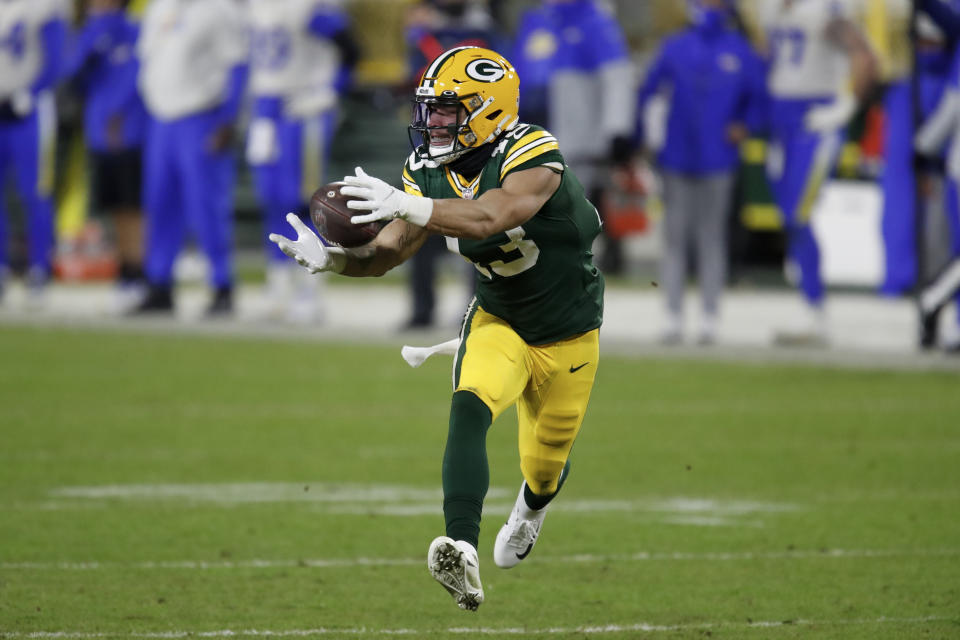 Green Bay Packers' Allen Lazard catches a pass to score on a 58-yard touchdown play during the second half of an NFL divisional playoff football game against the Los Angeles Rams Saturday, Jan. 16, 2021, in Green Bay, Wis. (AP Photo/Matt Ludtke)