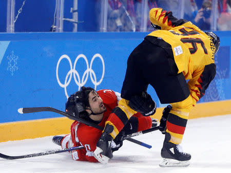 Ice Hockey - Pyeongchang 2018 Winter Olympics - Men's Playoff Match - Switzerland v Germany - Gangneung Hockey Centre, Gangneung, South Korea - February 20, 2018 - Andres Ambuhl of Switzerland and Yannic Seidenberg of Germany in action. REUTERS/Brian Snyder