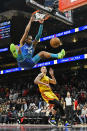 Charlotte Hornets forward PJ Washington, top, makes a slam dunk during the second half of an NBA basketball game against the Atlanta Hawks on Sunday, Dec. 5, 2021, in Atlanta. (AP Photo/Edward M. Pio Roda)