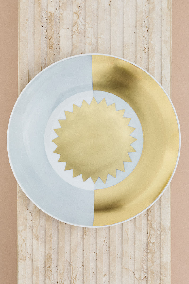 A sun motif figures on one of the Gio Ponti plate designs.