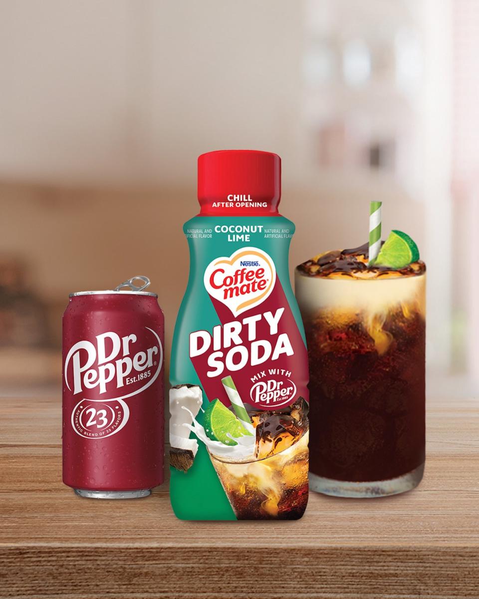 A bottle of Dirty Soda Coffee mate Creamer next to a can of Dr. Pepper and a glass of dirty soda