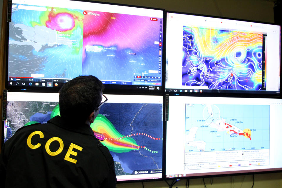 <p>A member of the Emergency Operations Committee (COE) monitors the trajectory of Hurricane Irma in Santo Domingo, Dominican Republic, Sept. 6, 2017. (Photo: Ricardo Rojas/Reuters) </p>