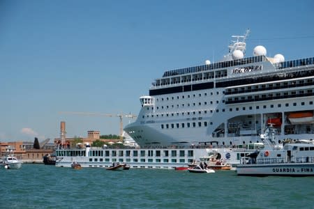 FILE PHOTO: The cruise ship MSC Opera loses control and crashes against a smaller tourist boat at the San Basilio dock in Venice