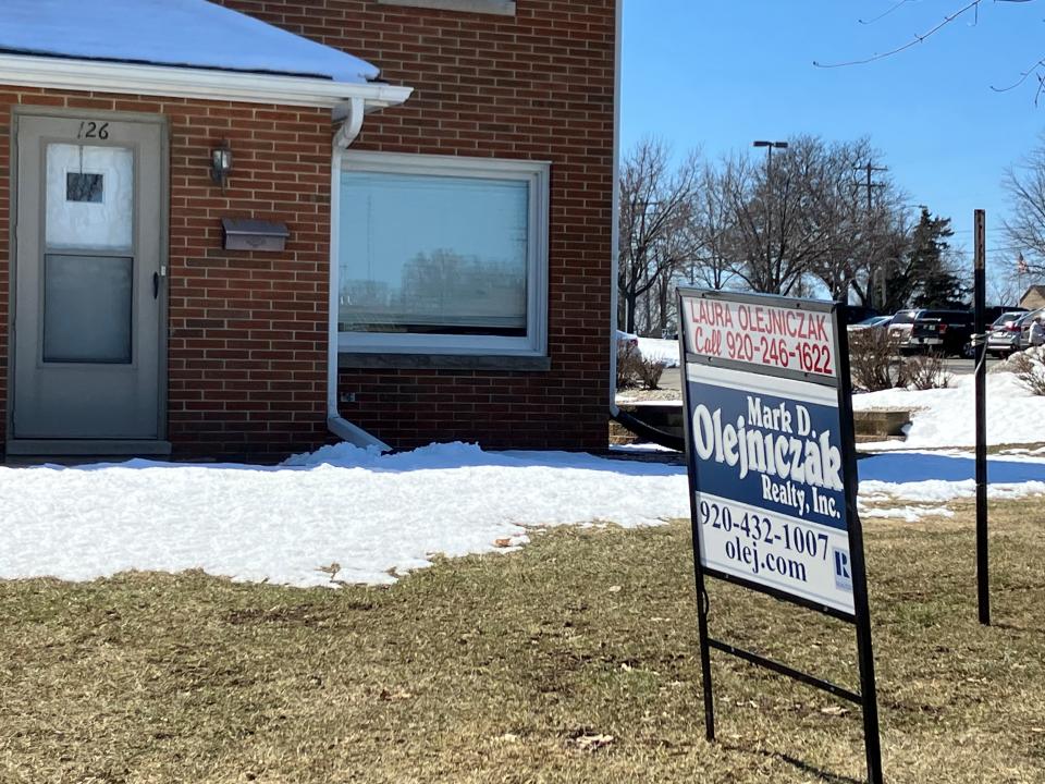 A for sale sign on a duplex in Allouez in late March 2023.