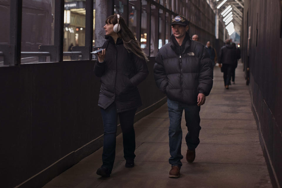 People walk next to a building under construction on Tuesday, Jan. 17, 2023, in New York. After the relative quiet of the pandemic, New York City has come roaring back. Just listen: Jackhammers disrupt the peace and fleets of honking cars, trucks and buses again clog thoroughfares as millions of denizens return to the streets — their voices and clacking heels adding to the ear-splitting din. In one of the world's noisiest cities, the cacophony has returned louder than ever. (AP Photo/Andres Kudacki)