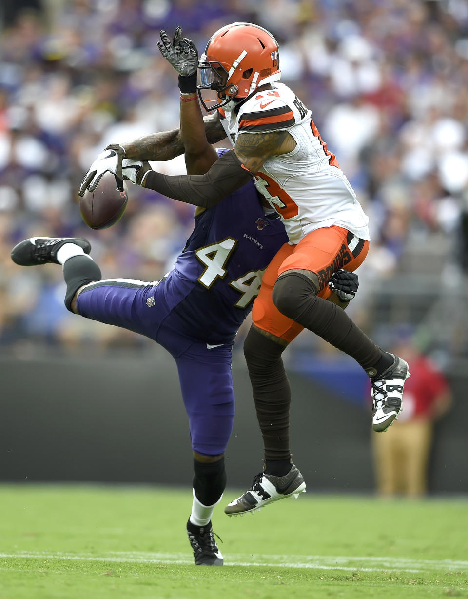 Baltimore Ravens cornerback Marlon Humphrey (44) disrupts a pass intended for Cleveland Browns wide receiver Odell Beckham (13) during the second half of an NFL football game Sunday, Sept. 29, 2019, in Baltimore. (AP Photo/Gail Burton)