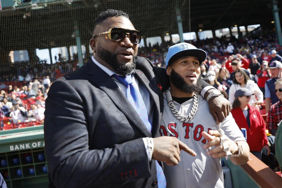 Former Boston Red Sox player David Ortiz, left, stands with Dominican rapper El Alfa El Jefe, right, before a baseball game between the Red Sox and the Washington Nationals, Saturday, May 11, 2024, in Boston. (AP Photo/Michael Dwyer)