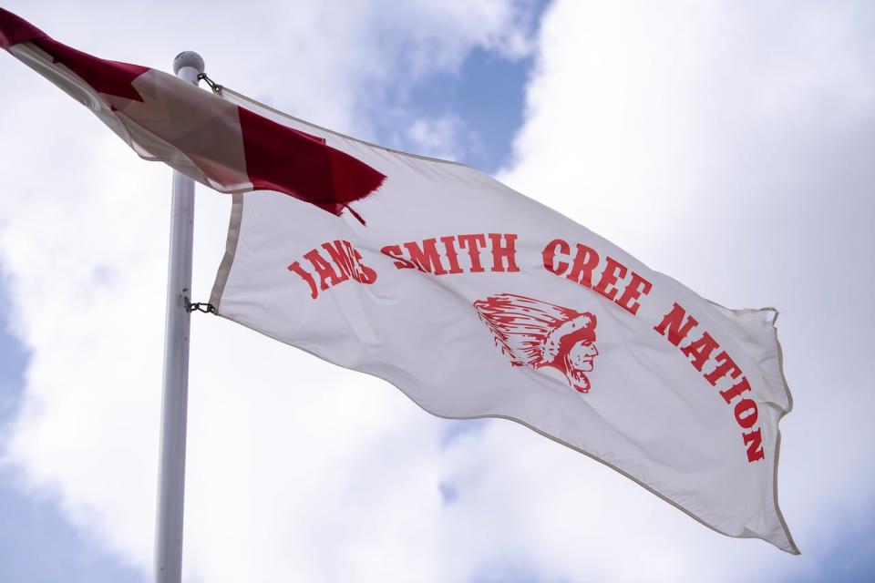 Flags fly outside of the Health Clinic and Band Office in James Smith Cree Nation, Sask., Wednesday, August 9, 2023.