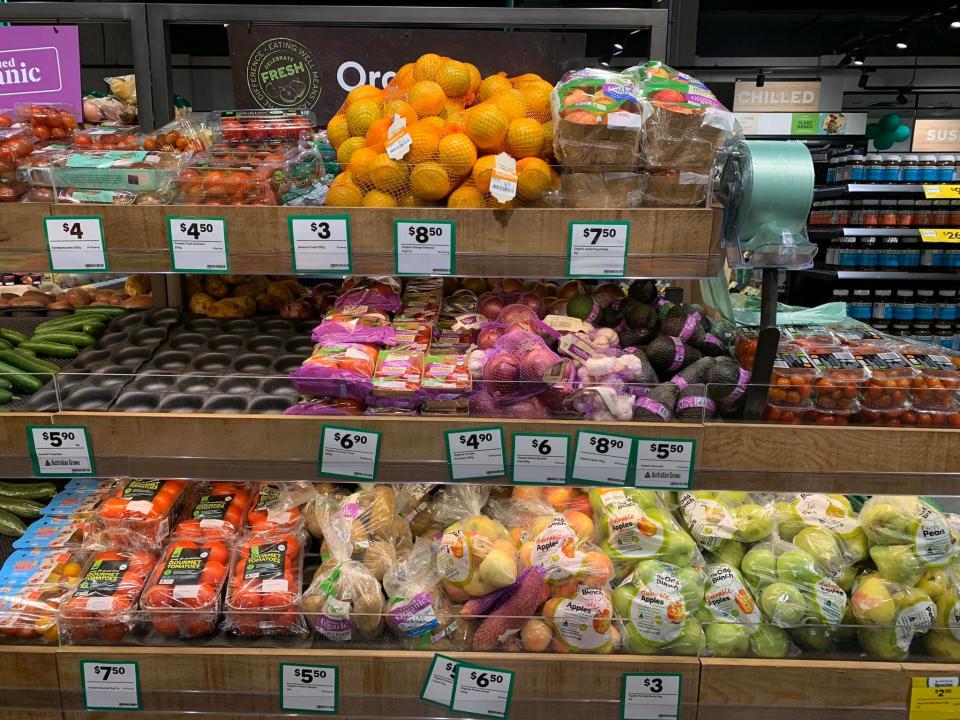 Fruit and veg are seen wrapped in plastic on a shelf at Woolworths in Roseberry.