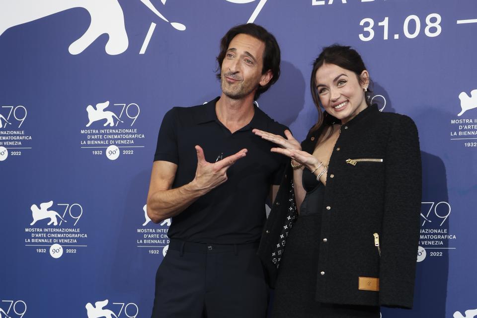 Adrien Brody, left, and Ana de Armas pose for photographers at the photo call for the film 'Blonde' during the 79th edition of the Venice Film Festival in Venice, Italy, Thursday, Sept. 8, 2022. (Photo by Joel C Ryan/Invision/AP)