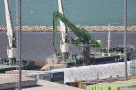 Grain from the Russian-owned cargo ship Fedor is loaded onto trucks in Bandirma, Turkey, on June 17, 2022. The grain, which satellite imagery shows was loaded at the Russian-occupied Ukrainian port of Sevastopol, Crimea, was purchased by the Turkish food company Yayla Agro. A spokesman for the company said it had been provided documents stating the cargo had come from the small Russian port of Kavkaz, more than 160 miles to the east of Sevastopol. (AP Photo/Yoruk Isik)