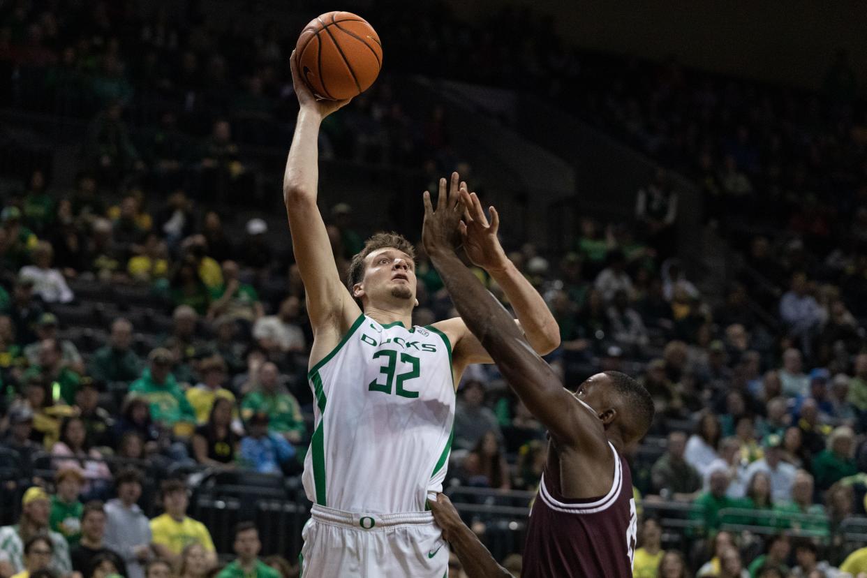 Oregon center Nate Bittle attempts a turnaround shot against Montana at Matthew Knight Arena Nov. 10.