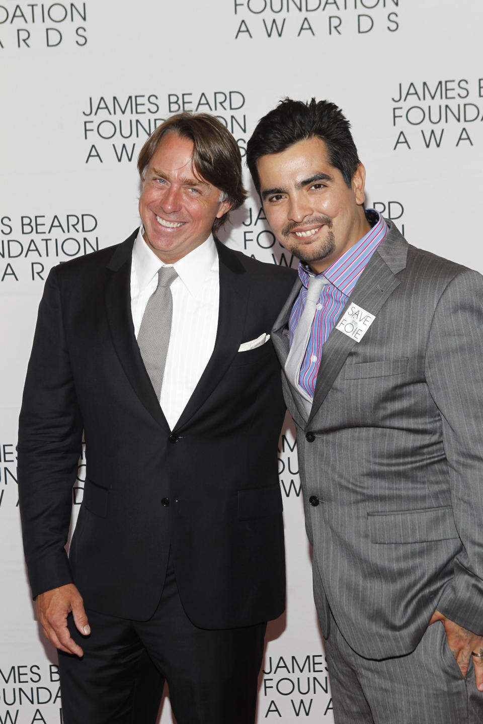 Chefs John Besh, left, and Aaron Sanchez arrive for the James Beard Foundation Awards, Monday, May 7, 2012, in New York. (AP Photo/Jason DeCrow)