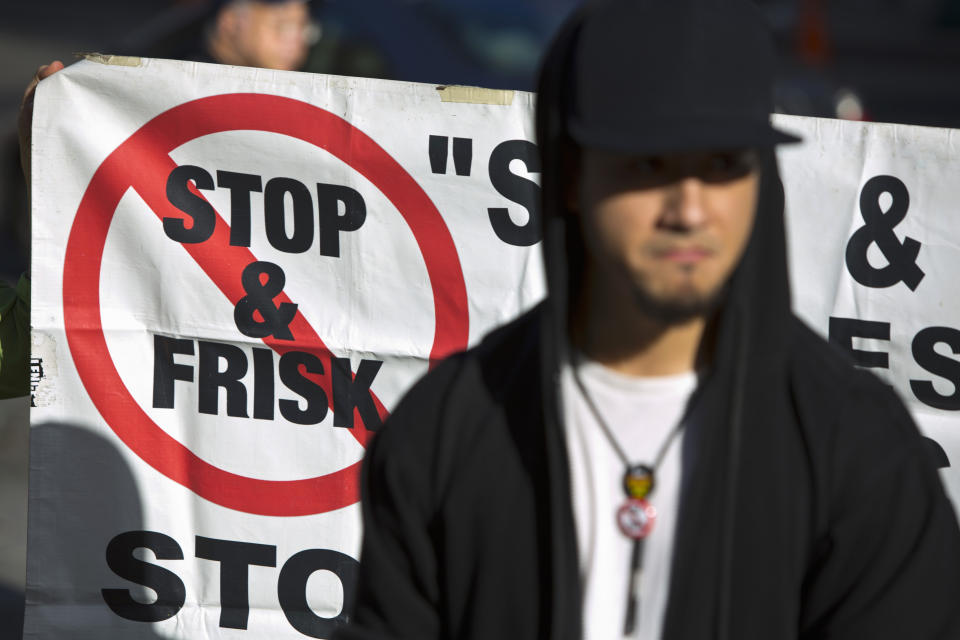 People attend a news conference against the Stop-and-Frisk program, outside the Federal Court in New York November 1, 2013. A U.S. appeals court froze court-ordered reforms to the New York City Police Department's controversial stop-and-frisk program and removed the judge who found the police tactic unconstitutional because she "ran afoul" of the judicial code of conduct. REUTERS/Andrew Kelly (UNITED STATES - Tags: CRIME LAW CIVIL UNREST POLITICS)