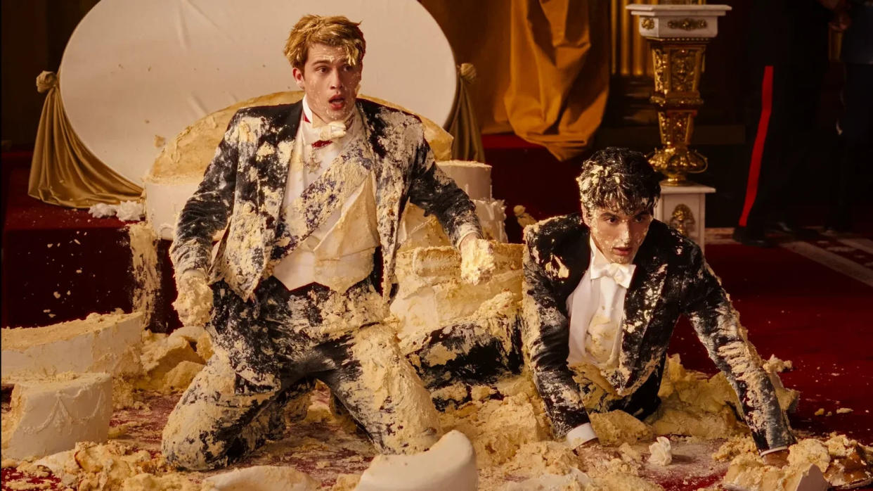 Nicholas Galitzine and Zakhar Perez covered in cake in 'Red, White and Royal Blue.'