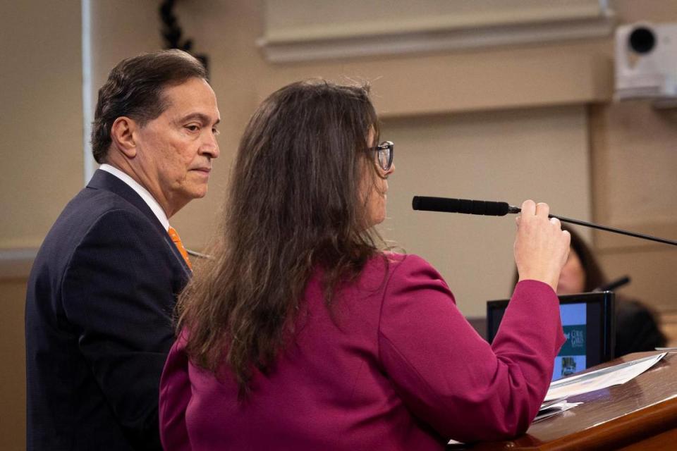 Jorge Duyos, the city’s hired consultant for annexation, left, listens to Diana Gomez, finance director, during a presentation about the potential annexation of Little Gables at a Coral Gables City Commission meeting on Tuesday, Nov. 14, 2023, at City Hall in Coral Gables. Alie Skowronski/askowronski@miamiherald.com