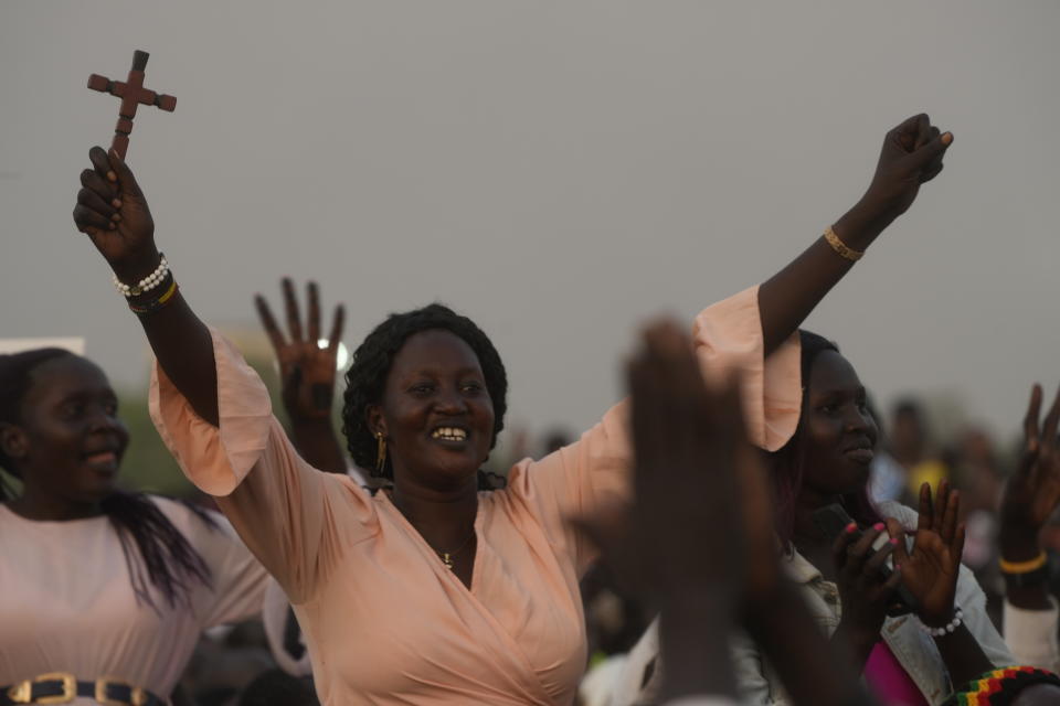 People wait for Pope Francis arrival at John Garang Mausoleum in Juba, South Sudan, Saturday, Feb. 4, 2023. Francis is in South Sudan on the second leg of a six-day trip that started in Congo, hoping to bring comfort and encouragement to two countries that have been riven by poverty, conflicts and what he calls a "colonialist mentality" that has exploited Africa for centuries. (AP Photo/Gregorio Borgia)