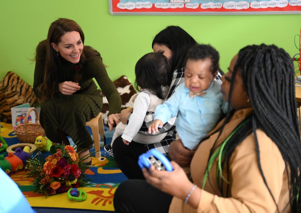 Princess of Wales talks with parents and children during her visit to Colham Manor Children's Centre 