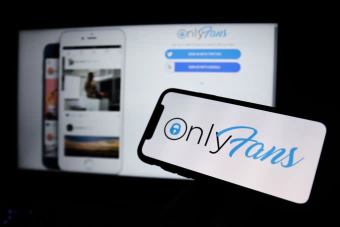 OnlyFans logo displayed on a phone screen and a website