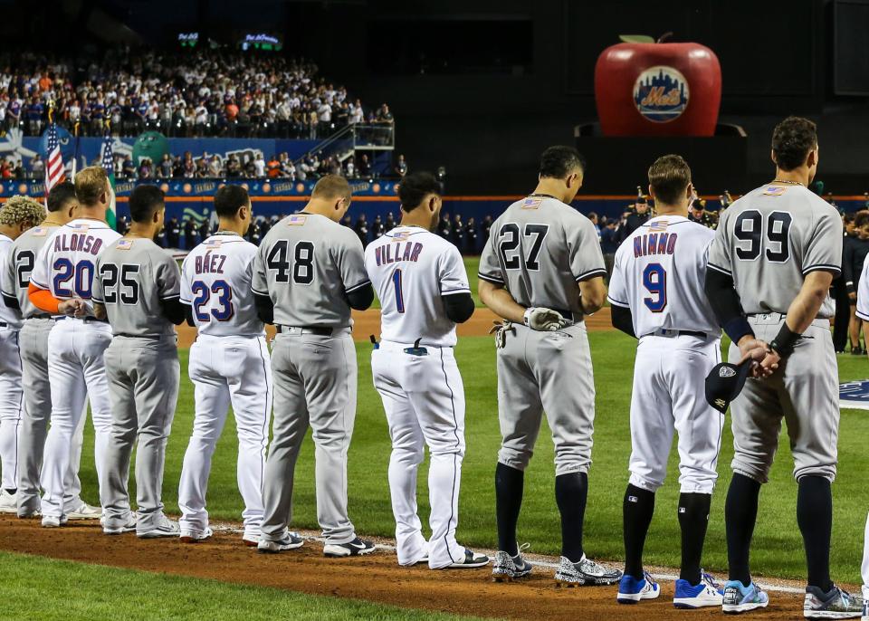 Mets and Yankees players line up during ceremonies prior to the game on Sept. 11 at Citi Field.